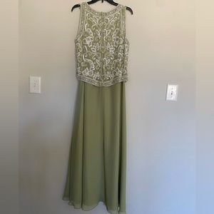 Beautiful beaded green gown.